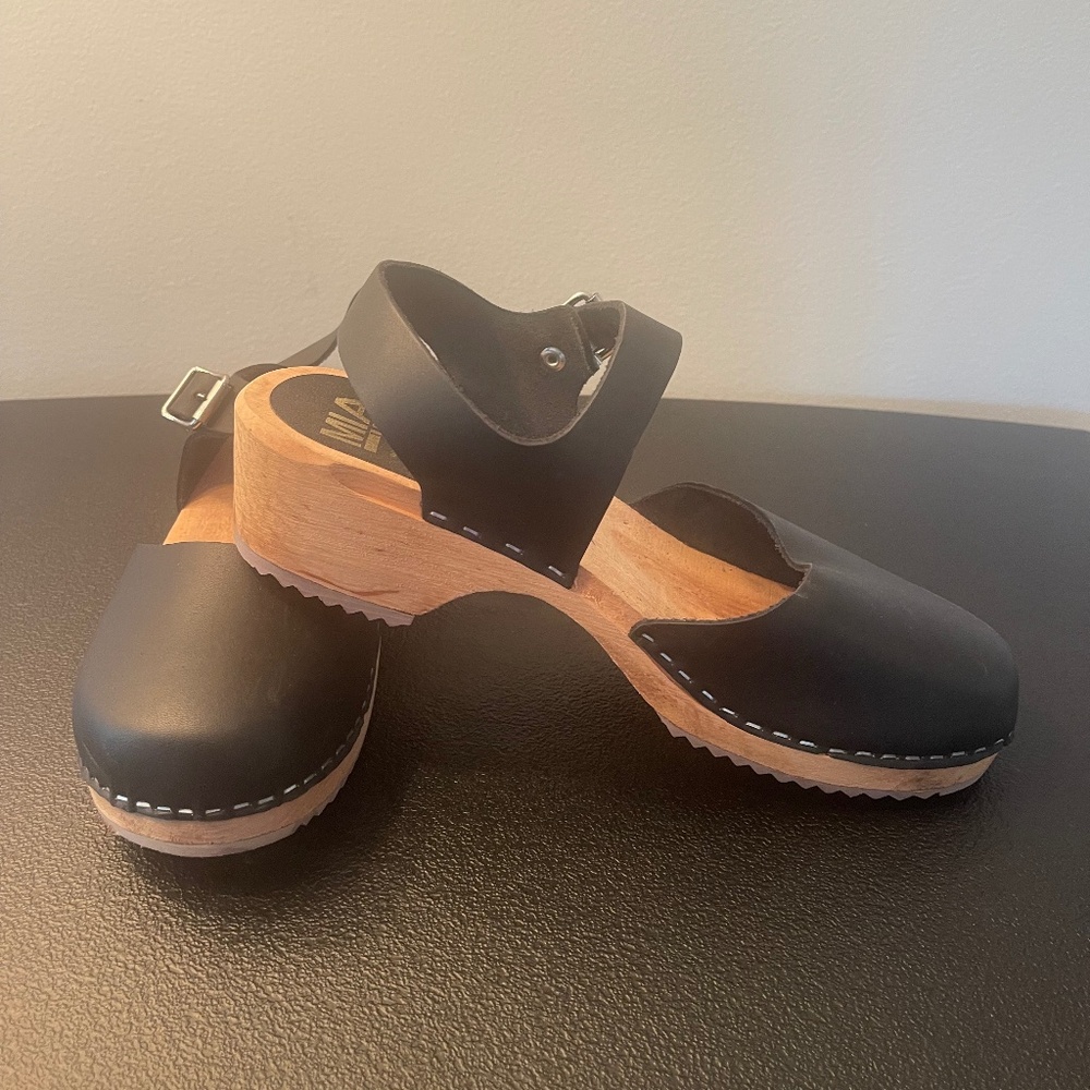 Black leather clogs